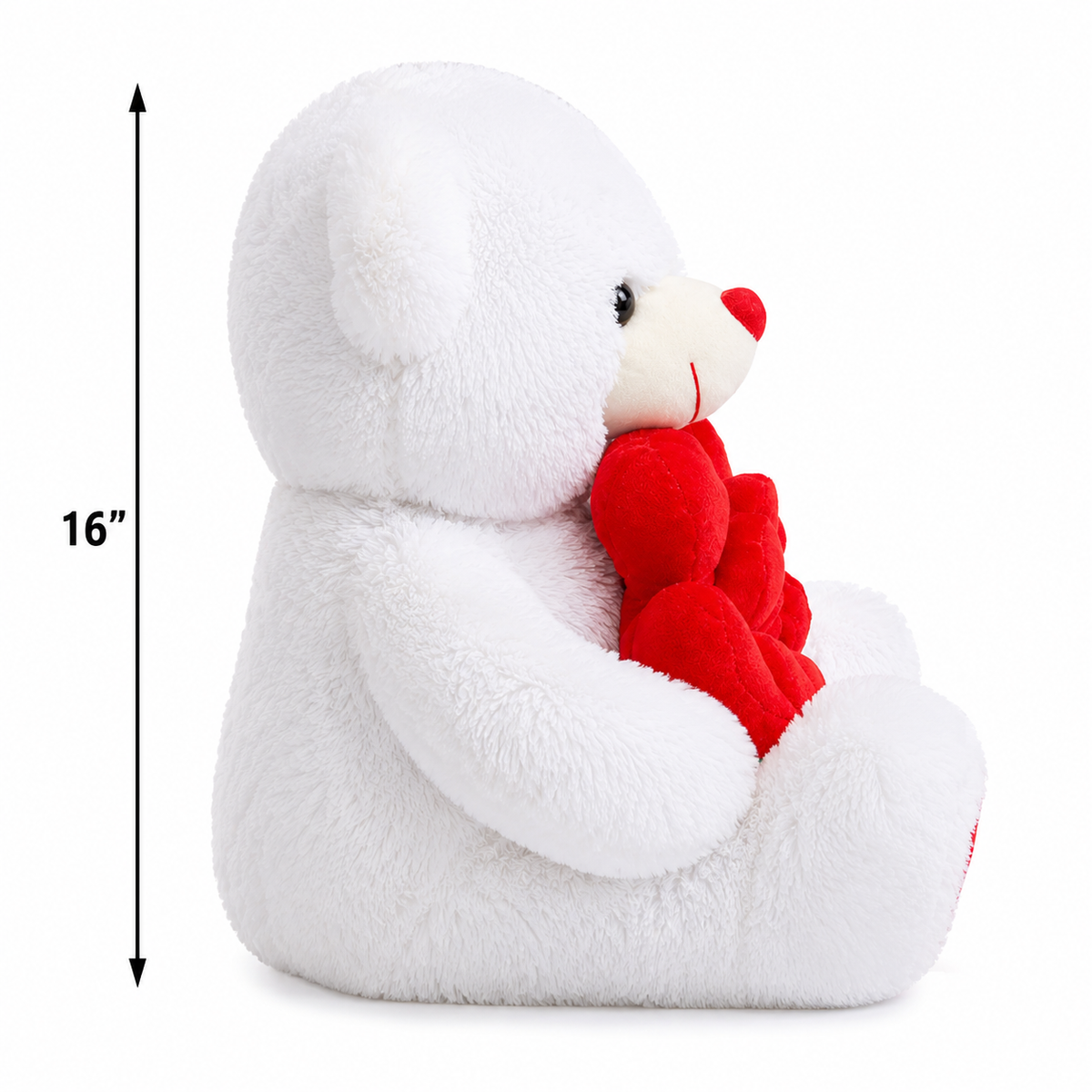 A white plush teddy bear sitting and holding a red plush heart, shown on a white background with a vertical 16-inch height marker on the left.