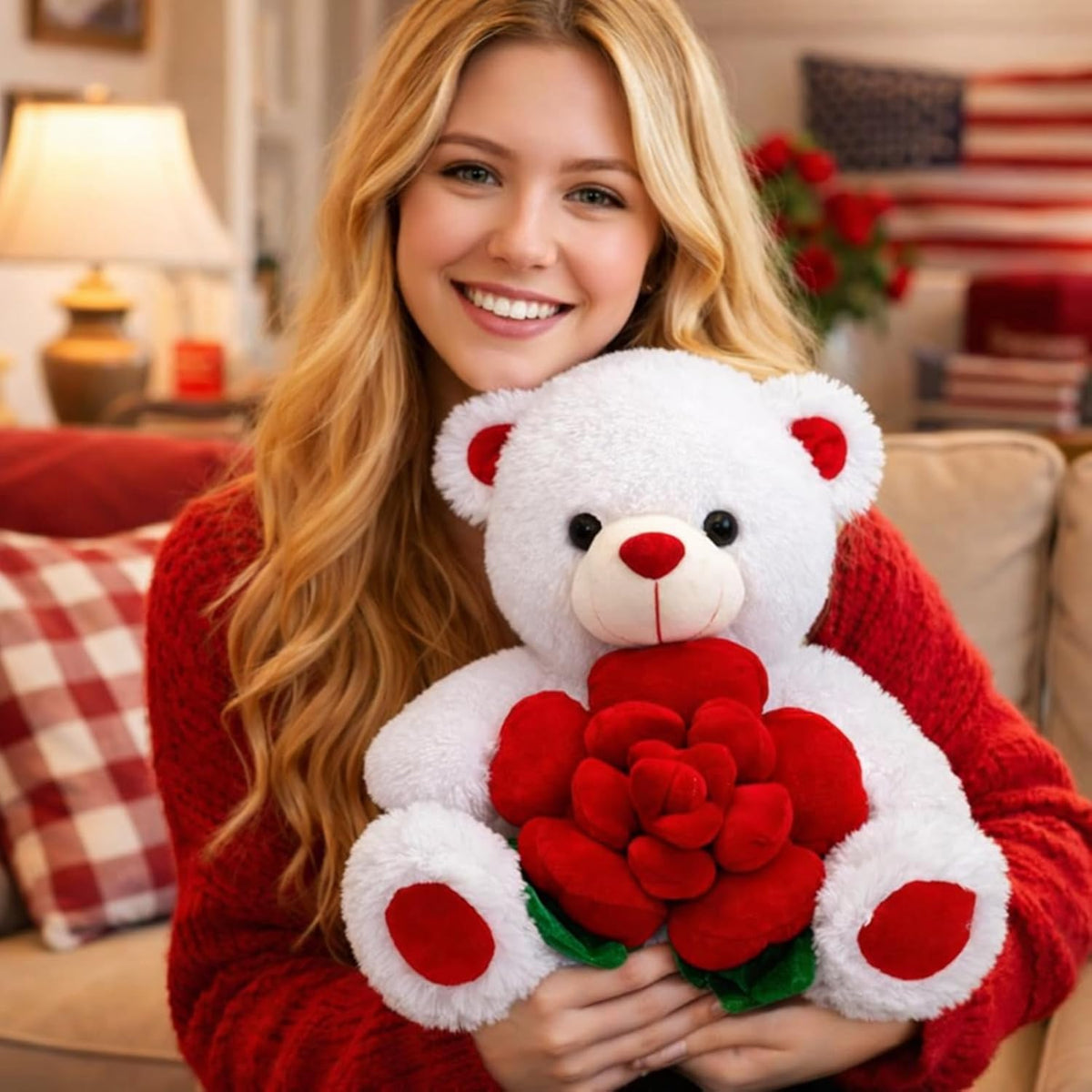 Woman holding a white teddy bear with red roses in a cozy living room.