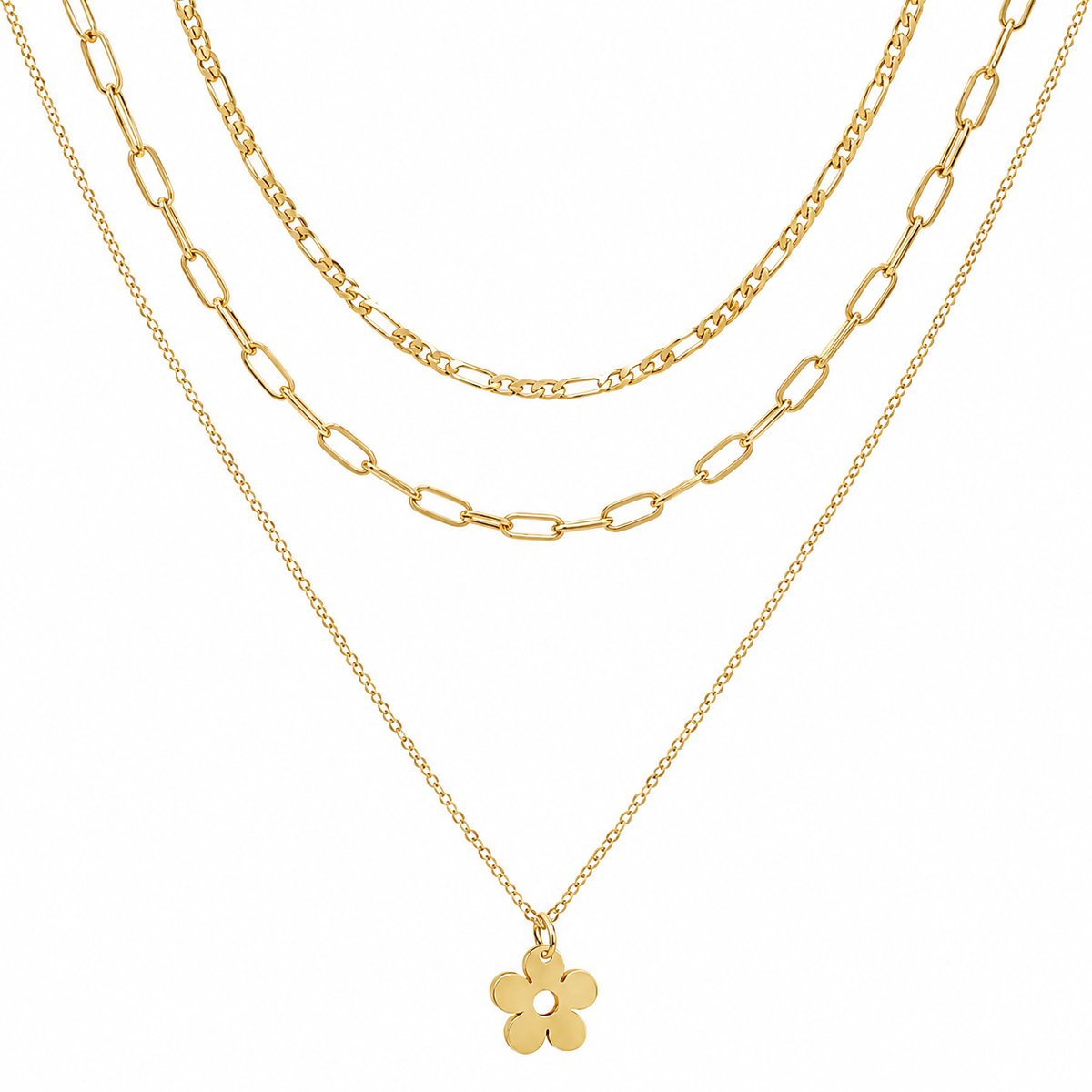 A gold layered necklace set featuring three distinct chain styles: a delicate cable chain, a medium Figaro chain, and a fine paperclip chain with a small five-petal flower pendant, shown against a solid white background.