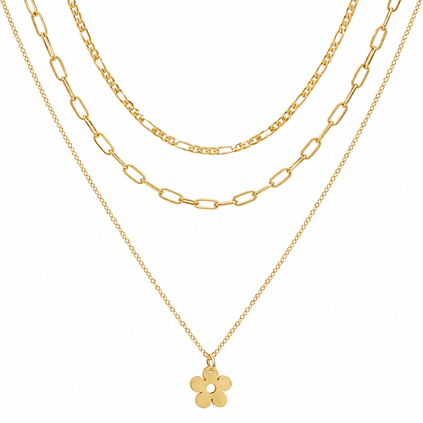 A gold layered necklace set featuring three distinct chain styles: a delicate cable chain, a medium Figaro chain, and a fine paperclip chain with a small five-petal flower pendant, shown against a solid white background.