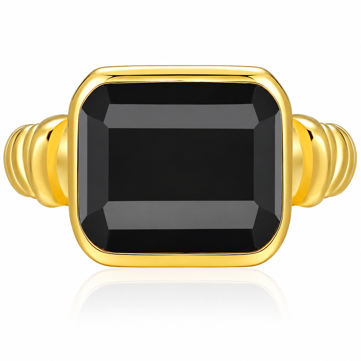 A gold ring featuring a large, faceted rectangular black gemstone in a bezel setting, with a ribbed gold band on a clean white background.